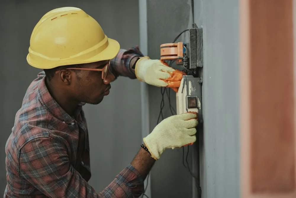 Electrician working on a wall installation