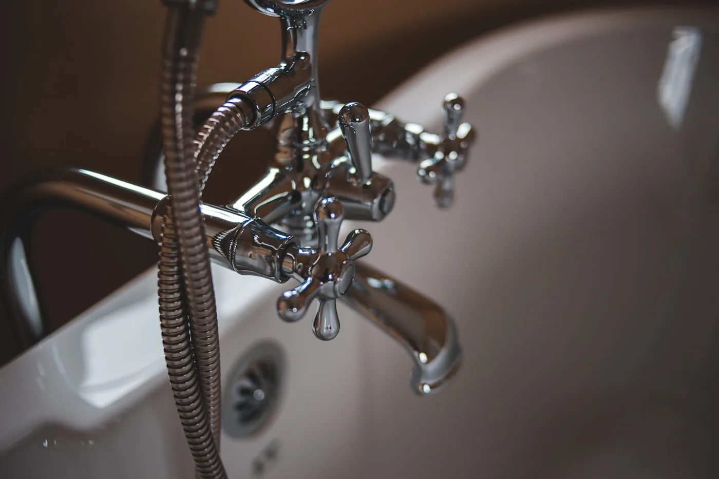 Chrome plumbing fixtures in a residential bathroom
